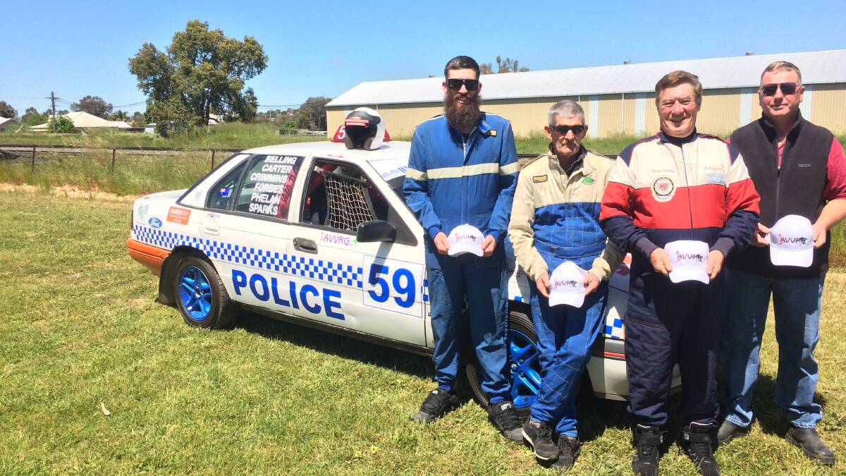 READY FOR ACTION: Racers Josh Crimmins, Joe Belling and Kerry Phelan with car owner Roger Moore. The team will compete at the 24 Hours of LeMons in Goulburn.