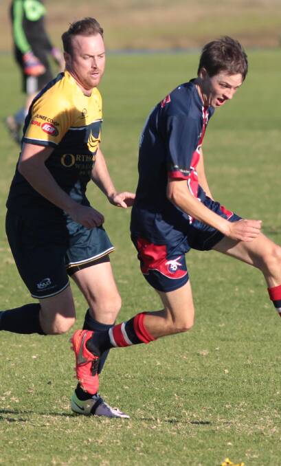 STEPPING UP: Junee Jaguars coach Lincoln Weir, pictured chasing Henwood Park's Sam Thompson, will likely share goalkeeping duties with his brother, Adrian Weir. 