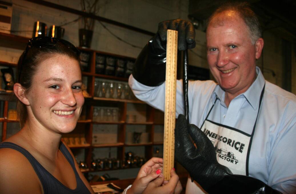 MEASURING STICK: Lauren Herbert and Neil Druce examining how the factory's licorice measured up in 2014. 