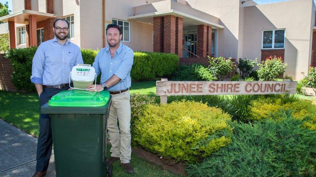GOING GREEN: Director of engineering services Will Barton and Cr Robin Asmus with the new organic collection bins that will be delivered to Junee households in the coming weeks. 