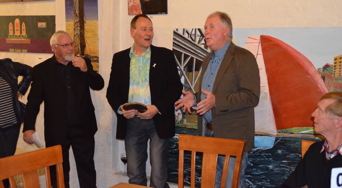 Volunteer art teacher Anthony Boerboom, Junee mayor Neil Smith and Junee Licorice and Chocolate Factory owner Neil Druce.