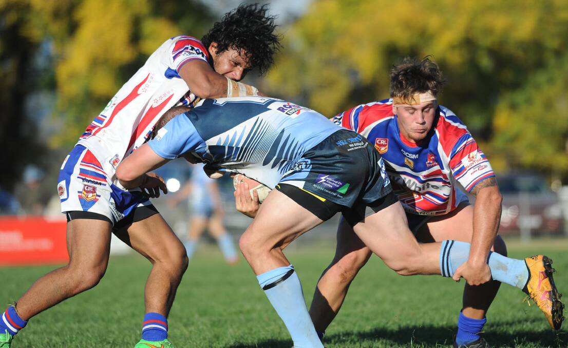 IN-FORM: Young halfback Raymond Talimalie (left) brings down Tumut's Hayden Cowled in a Group Nine game this month. Talimalie leads the Weissel Medal after eight rounds. Picture: Laura Hardwick