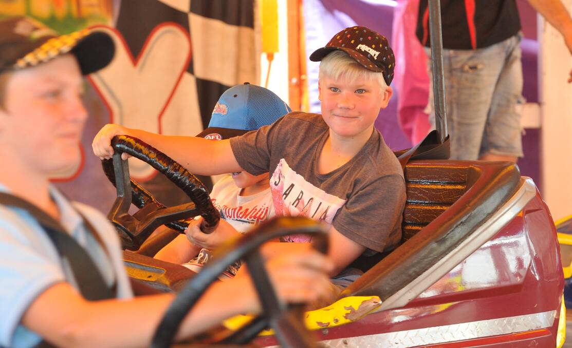 YOUNG driver Lachlan Kotzur keeps his eyes peeled while piloting his dodgem car at last year's show.