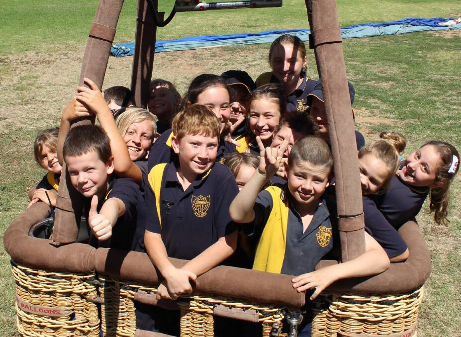 TAKE OFF: It was all smiles at Junee Pubic School last week when the RAAF brought a hot air balloon for a special science lesson. Picture: Supplied