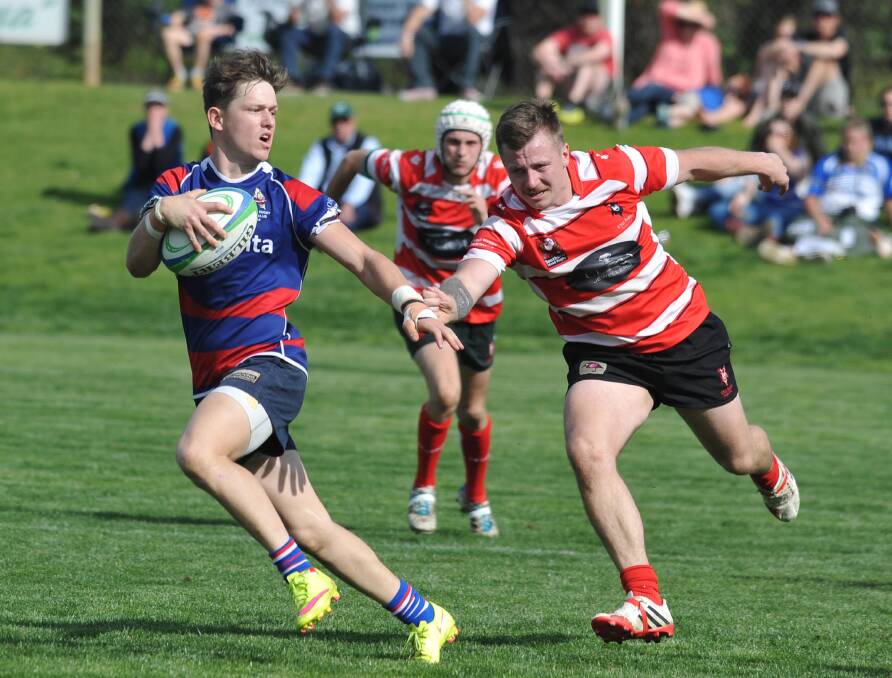 IN ACTION: Temora's Hayden Philp trying to get away from CSUs Jake Busby in the first grade final in September. Picture: Laura Hardwick