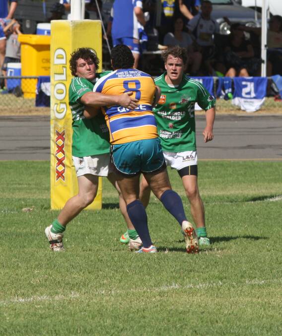 HARD HIT: Leeton takes on eventual comp winners Junee in the inaugural Cootamundra Nines at the weekend. Junee pocketed $2000 in prizemoney. Picture: Daisy Huntly