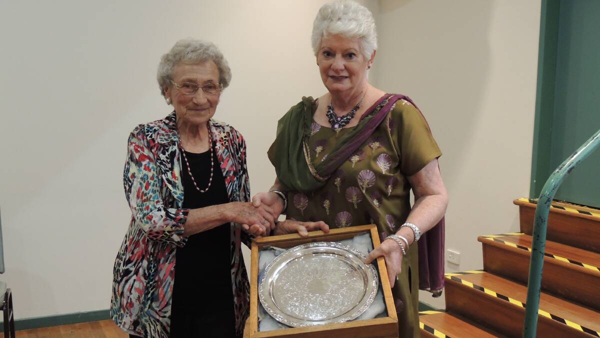CONGRATULATIONS: Helen Hillyer presents the Helen Hillyer Trophy for the best international report to Gail Commens, president of Eurongilly Branch. Picture: Contributed