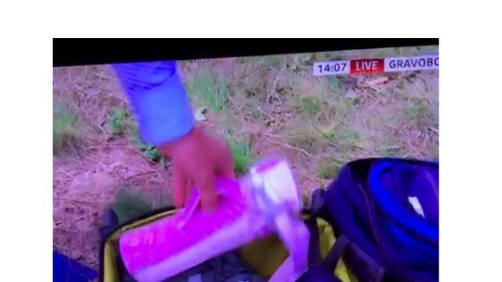 Sky reporter Colin Brazier searched through luggage at the crash site. Photo: Sky News