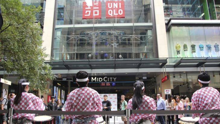 Drummers mark the opening of the Uniqlo store in the Mid City Centre in Sydney.