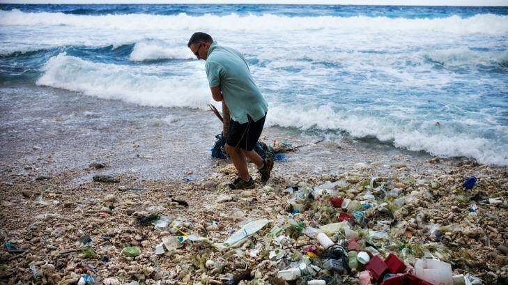 Outgoing administrator of Christmas Island Jon Stanhope at Dolly Beach, which is littered with plastic rubbish. Photo: Tony McDonoough