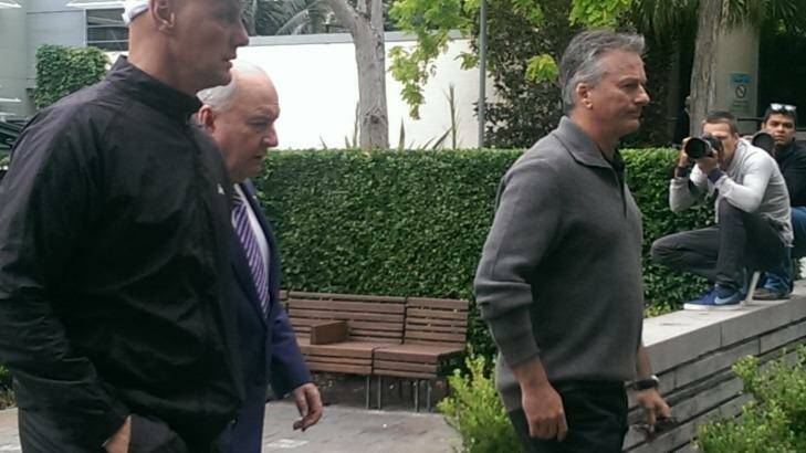 Alan Jones, Steve Waugh, right, and  Channel Ten reporter Andrew Denney, left, leave the hospital together. Photo: Melanie Kembrey