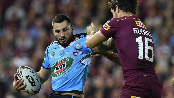 Confident: Jack Bird is tackled by Aidan Guerra of the Maroons during game two of the State Of Origin series on Wednesday.
