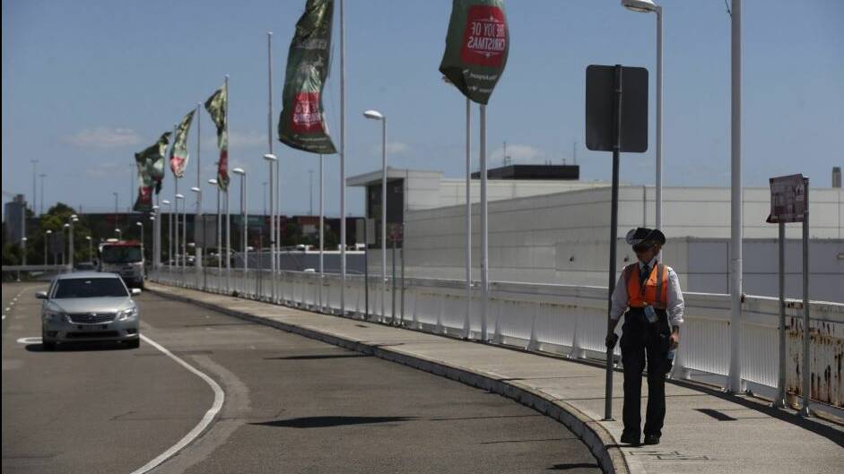 A security officer patrols the departures area of Sydney International airport. Photo: Kate Geraghty