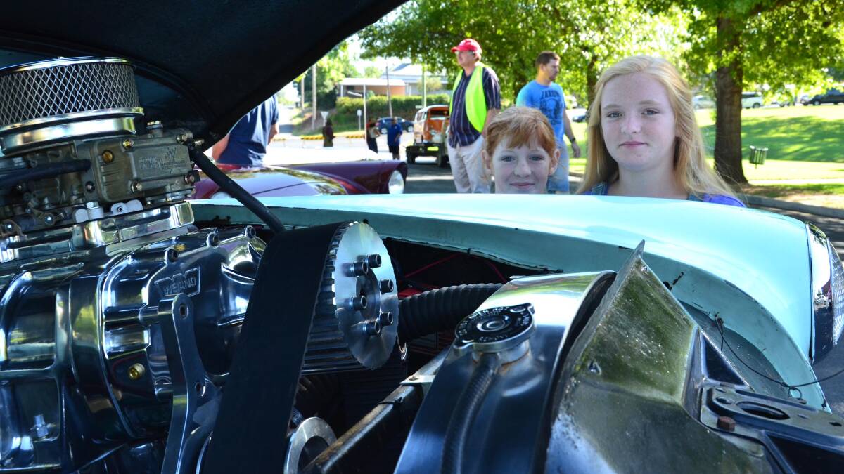 Sarah Oriel, 10 and Lilly Oriel, 12 with their dad's Oldsmobile "Rocket" 88. Picture: Declan Rurenga