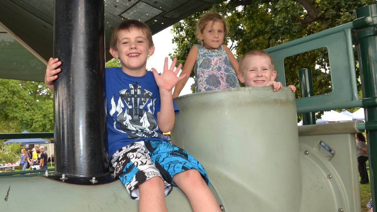 Thomas Smith, 6 of Junee, Stella Duck, 6 of Illabo and David Triance, 5 of Temora on the train play equipment at Memorial Park. Picture: Declan Rurenga