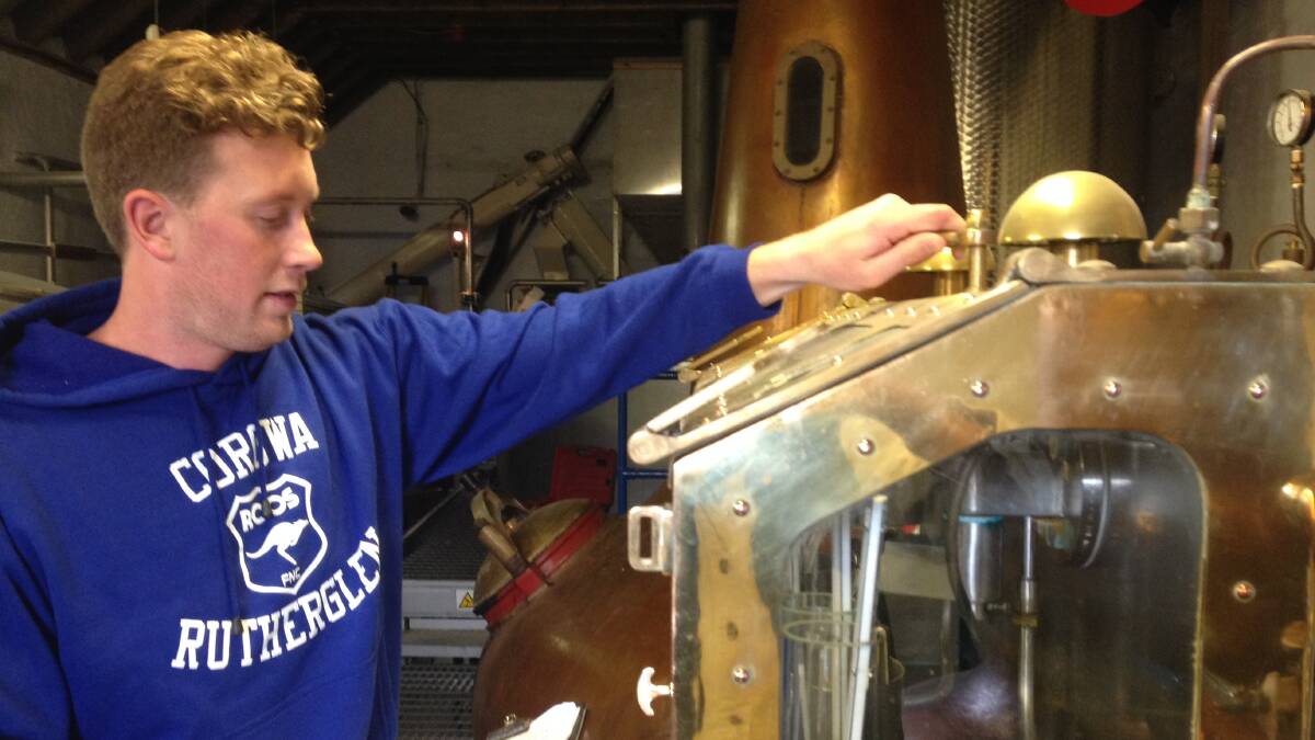 WHISKY IN MOTION: Dean Druce works the spirit safe which allows the spirit coming from the pot still to be anaylsed. Picture: Contributed