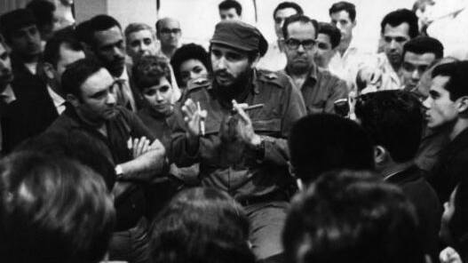 Fidel Castro and Osvaldo Dorticos Torrado talking to Cuban medical staff who are going to Peru to help with the aftermath of an earthquake, circa 1950. Photo: Getty Images. 