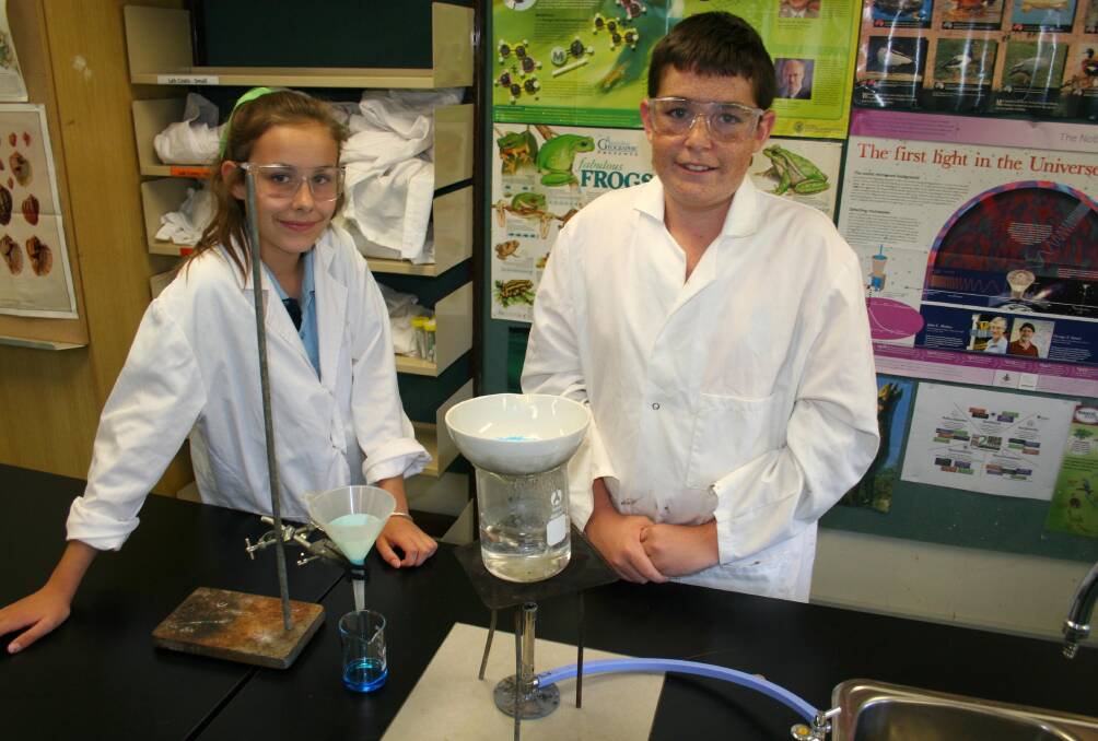 Creating copper sulphate in order to analyse the crystal structure is self-select year 7 and 8 students Charlotte Field, 13, and Caleb Sainsbury, 14. Picture: Declan Rurenga