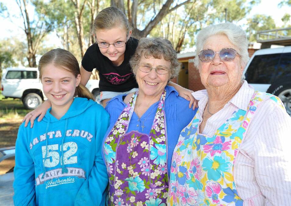 Having a good time at the Illabo Country Music Stampede is Zara Clemson, 11 and Ebony Sandland, 10 from Wagga, Junee's Laurel Clemson and Illabo's Mary Belling. Picture: Kieren L Tilly