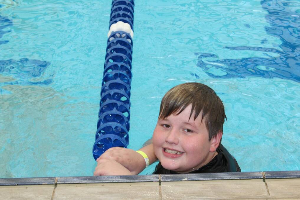 Ethan finishes relaxes after racing during Junee Public School's swimming carnival. Picture: Junee Public School
