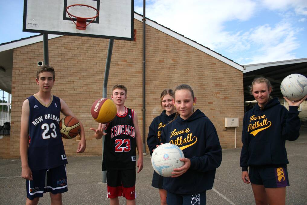 Junee Junior Netball Association is changing to provide a chance for more local basketballers, including Henry Commins, 14 and Eli Honner, 15, with netballers Ingrid Honner, 14, Hayley Stevens, 14 and Sarah Stevens, 15 keen to play during the off-season. Picture: Declan Rurenga