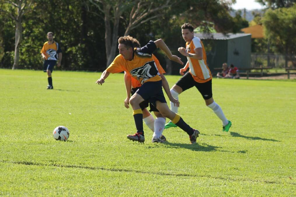 Junee's Owen Gill chases for possession during a game against Wagga United. Picture: Melanie Miller