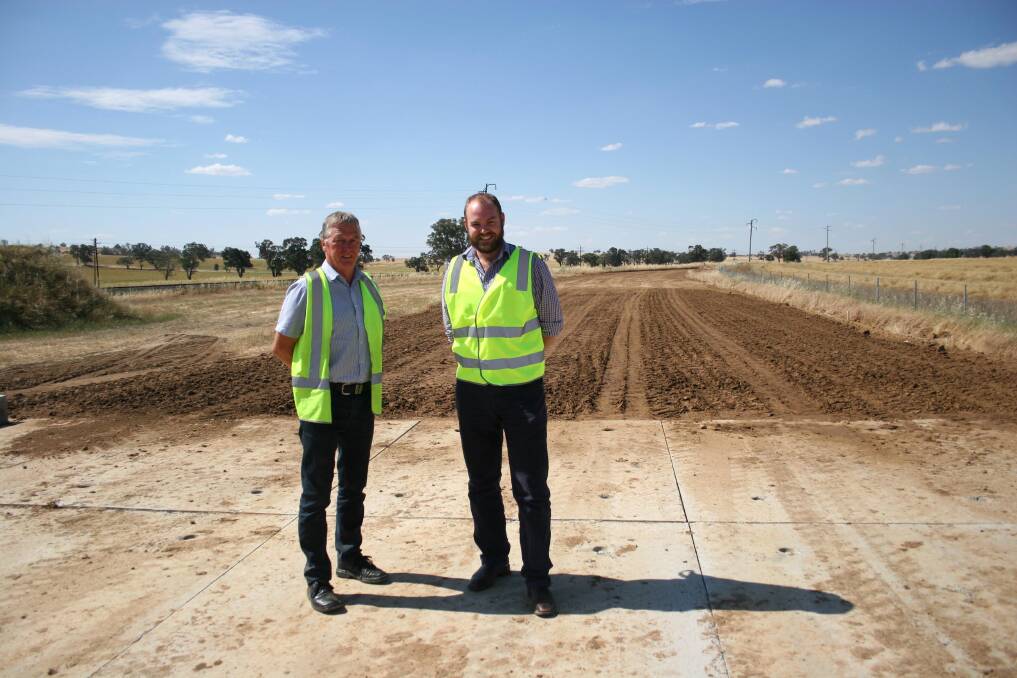 Retiring engineering services director Col Macaulay (left) and incoming director Will Barton survey the progress of the Harefield road deviation. Picture: Declan Rurenga