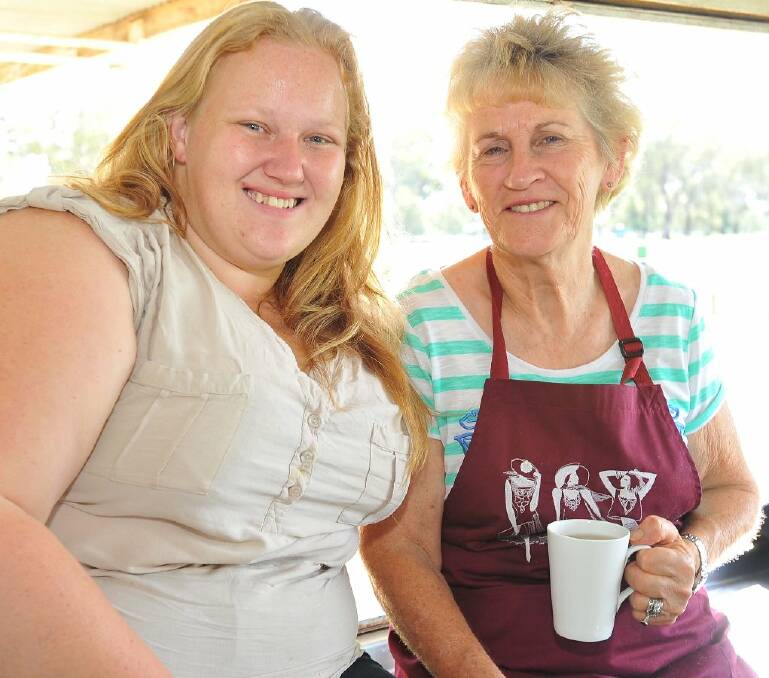 Coleambally's Kiri Smith and Loretta Willis from Yerong Creek catch up over a cuppa. Picture: Kieren L Tilly