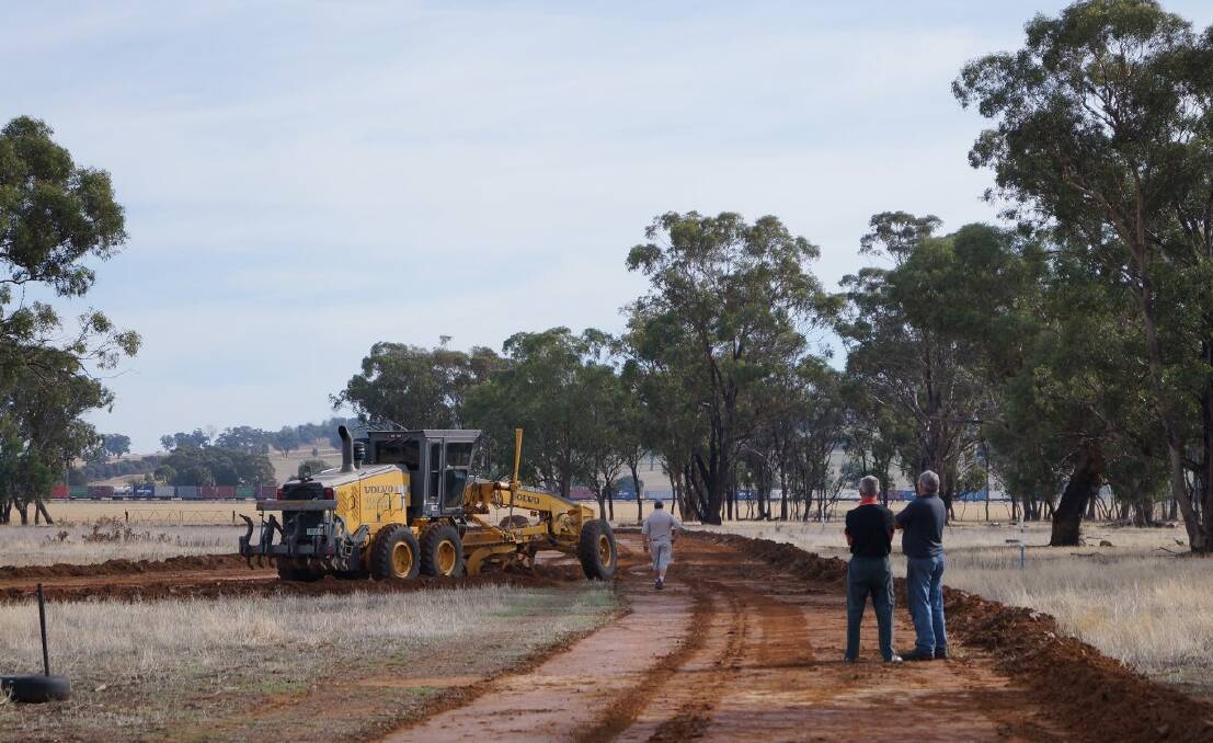 Leigh Sheather grades the foundation of the motorsport track at Illabo Showgrounds. Picture: Contributed