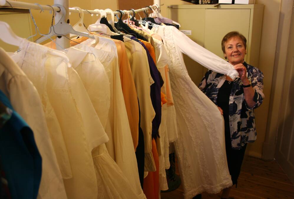 Broadway Museum volunteer Linda Calis with some of the period costumes set to be paraded during the Broadway Hotel's centenary celebrations on November 15. Picture: Declan Rurenga