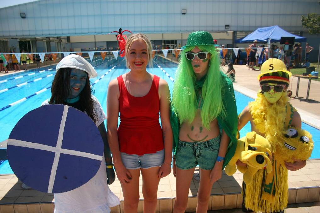 Showing off the best swimming carnival fashion are Lucy Clarke, 12, Ashley Hart, 17, Kaitlyn McRae, 14 and Brighton Parkhurst, 12, who were selected as the best dressed at Junee High School's swimming carnival. Picture: Declan Rurenga