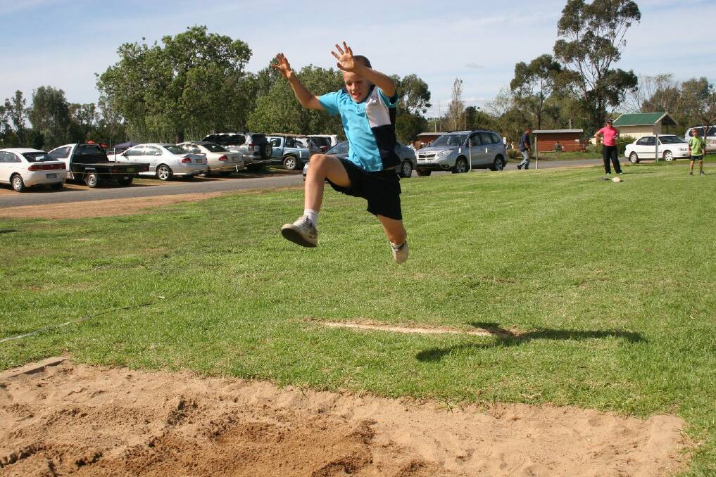 Zach Sheppard, 9 defies gravity during the long jump competition. Picture: Declan Rurenga
