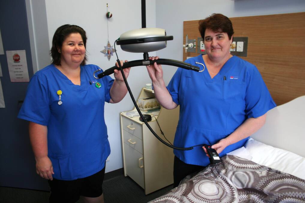 Assistants in nursing Erica Duck and Sharon Longmore with some of the new equipment provided by a donation from the Junee Hospital Auxiliary. Picture: Declan Rurenga