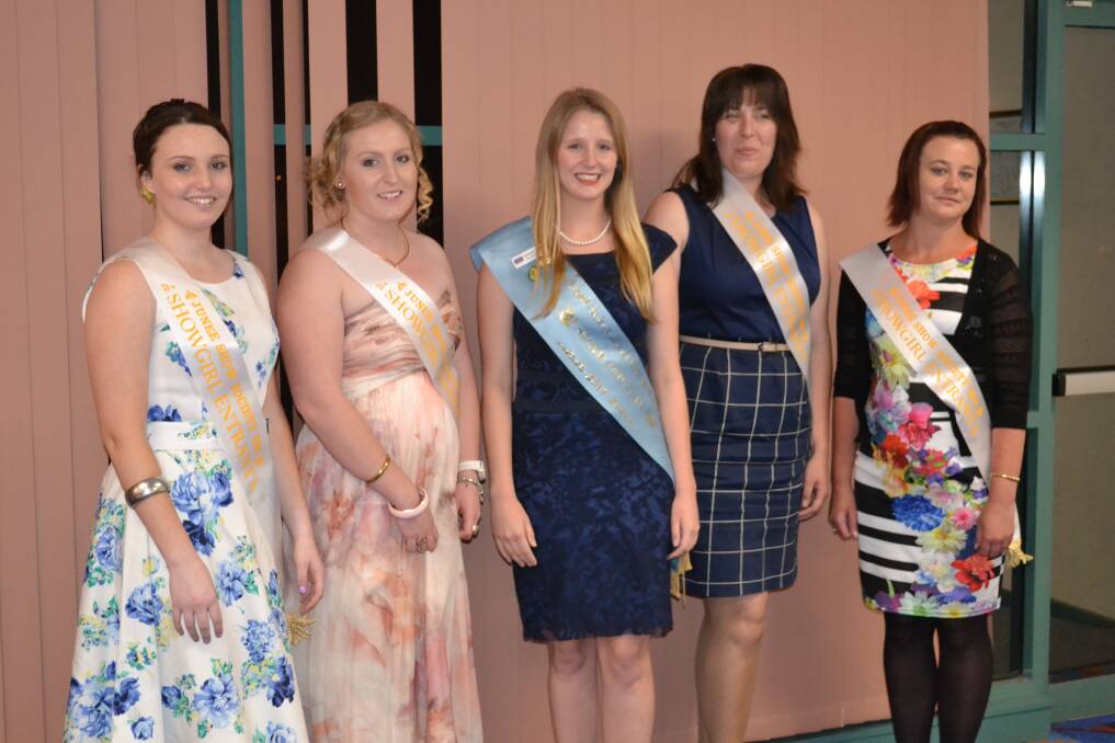 Entrants Ebony Becquet, Jemima Hart, Sarah Atherton and Sally Dean with 2013 showgirl Jasmine Corbett after the judging on Friday night at the Ex-Services Club. Picture: Adrian Eisenhauer