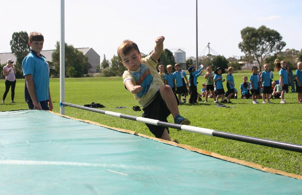 Charlie Sainsbury, 5 about to clear the high jump bar. Picture: Declan Rurenga