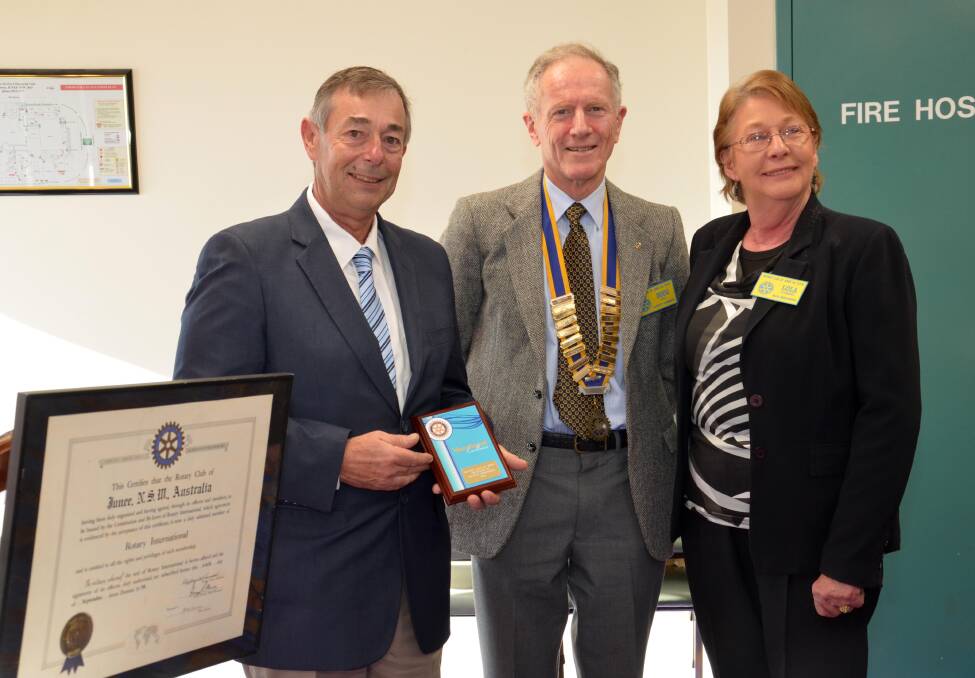 Junee Shire Council’s water treatment plant operator Mick Summerell is presented with a vocational service award by Junee Rotary Club’s president Doug Bell and mayor Lola Cummins. Picture: Declan Rurenga