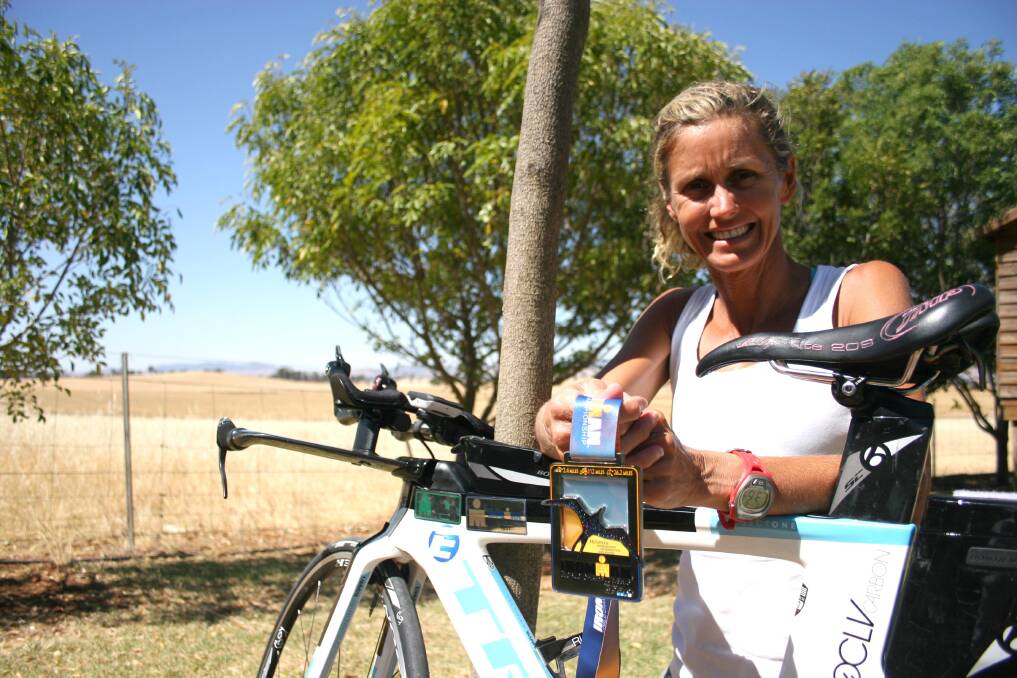 Eurongilly's Jenny Hart swam, cycled and ran over 226 kilometres of ocean and lavafields as part of the Kona Ironman challenge and was the first Australian to finish in her age group. Picture: Declan Rurenga