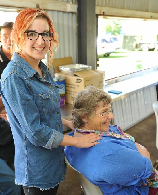 Official Stampede masseuse Amelia Nisbet from Wagga looks after Junee's Laurel Clemson. Picture: Kieren L Tilly