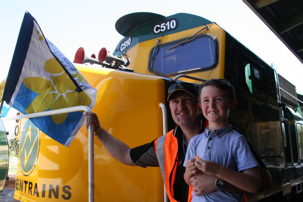 TRAIN CREW: Train driver Kev Schultz, with his son Ryan, 8 before heading off in C-Class Locomotive C510 to raise money for the Cancer Council. Picture: Declan Rurenga