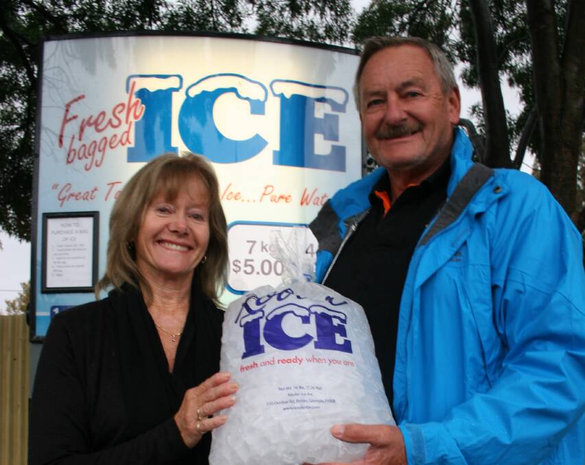 KEEPING IT COOL: Mandy and Greg Hanson have brought an ice vending machine to Junee which is open 24/7. Picture: Declan Rurenga