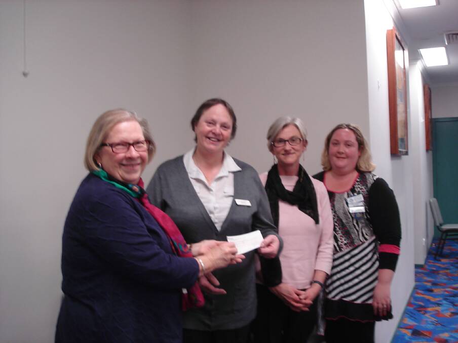 HELPING HAND: CWA members Anne McIntosh (second from left) and Gemma Marshall (right) present a cheque to Sisters Housing's Belinda McMahon and Ann Baker. Picture: Junee CWA