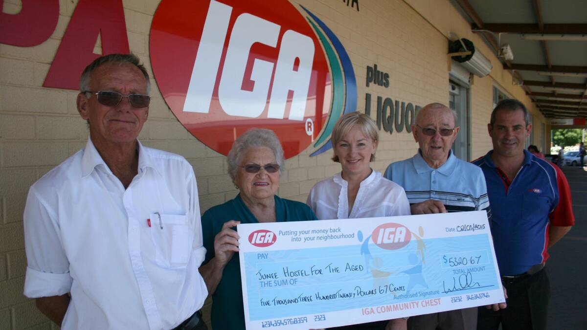 BIG BUCKS: IGA's Ian Cooper (left) and Shane Willis present Cooinda Court committee members June Jackson, Patricia Butler and Roger Quine with a cheque.