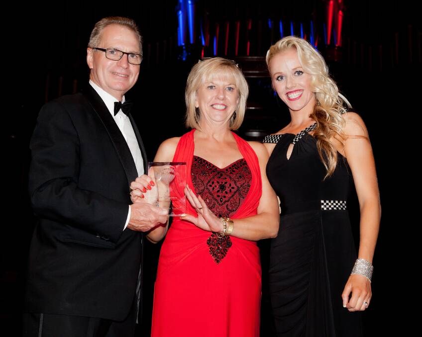 Remax Elite's owners Annette Pollard and Jenna Wright presented with an award by at the Remax Australia gala night. Picture: Contributed
