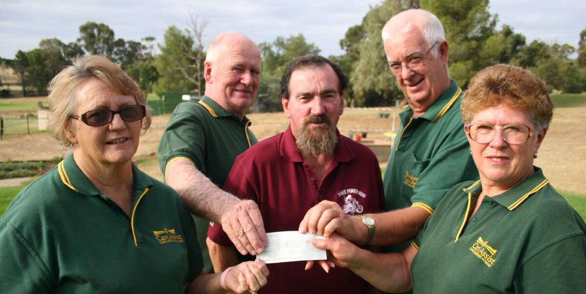THE WINNING HAND: Junee Poker Run's Ron Hindmarsh (centre) hands over a cheque to Junee Can Assist's Judy Gentle, Peter Mack, Joe Gregor and Lyn Whiles. Picture: Declan Rurenga
