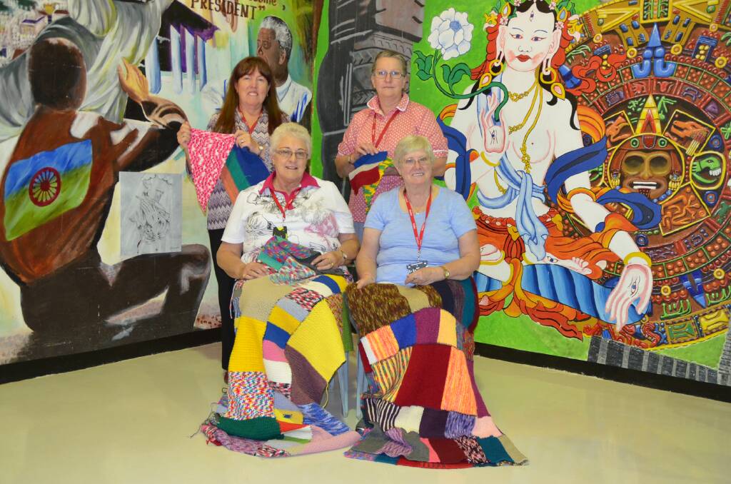 Wagga Purlers, Joanne Micenko (back, left), Stephanie Vineburg, Judy Davis (front, left) and Lois Cabot with some of the blankets knitted by inmates.
