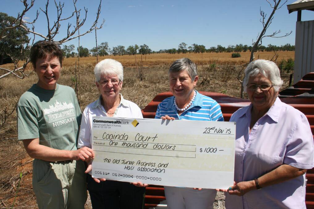 BOOST: Old Junee Hall president Michelle Grinter (left), secretary Bev Crowe and committee member Malveen Cochrane (right) present a cheque to Cooinda Court's Pam Halliburton. 