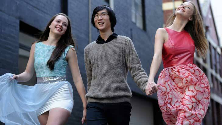 Fifteen-year-old fashion designer Andy Truong with models Beata Laurenson and Morgana Powell wearing his creations.