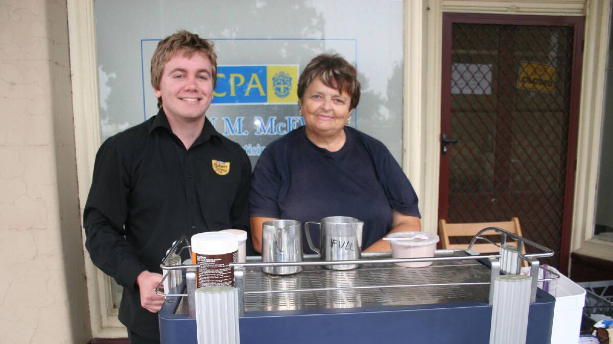 Brad Rogers and Janet Howell making coffee and provide some hot lamb pies for festival goers.
