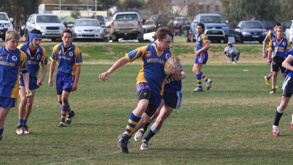 Kyle Dunstall finds a break an goes for a run in Under 14s.