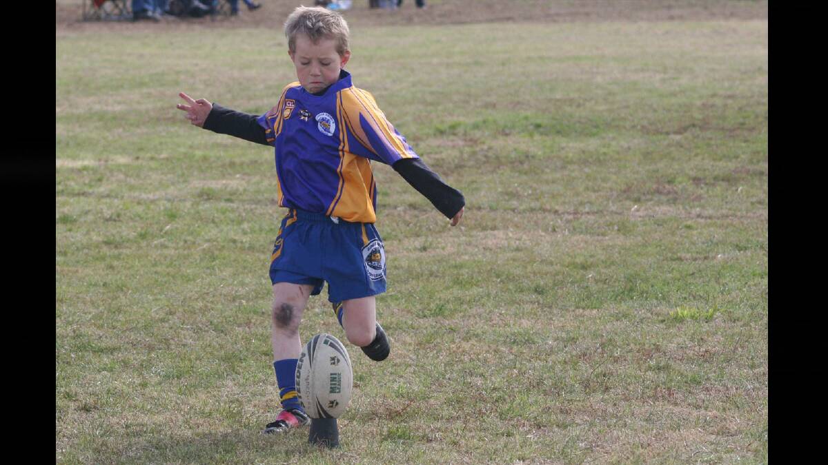 Nathan McInerney tries to convert but missed in Under 8s.